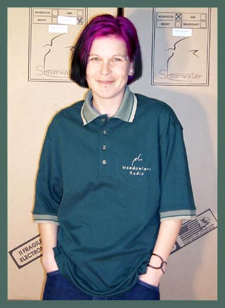 Joyce Models a Meadowlark Audio Golf Shirt