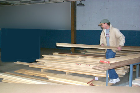 Joe stacks hardwood.