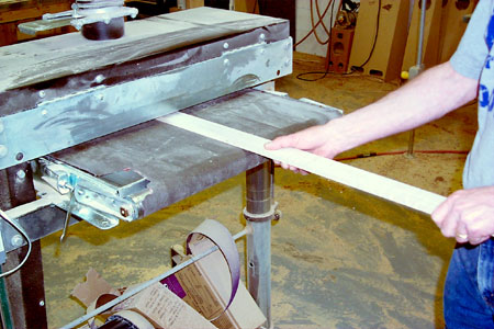 Hardwood stringers take a trip through the drum sander