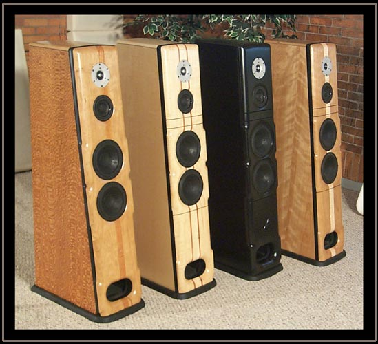 Meadowlark Audio Blue Heron 2's in a row.  Lacewood with Pennsylvania Cherry baffle and Mahogany Stringer, Curly Maple with Curly Maple Baffle and Double Aromatic Cedar Stringers, Ebony, and Ropey Cherry with Pennsylvania Cherry Baffle and Curly Maple Stringer