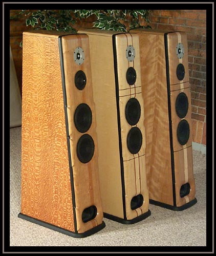 Meadowlark Audio Blue Heron 2's in a row.  Lacewood with Pennsylvania Cherry baffle and Mahogany Stringer, Curly Maple with Curly Maple Baffle and Double Cedar Stringers, Ebony, and Ropey Cherry with Pennsylvania Cherry Baffle and Curly Maple Stringer